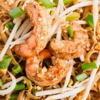Pad Thai · Spicy.  Flat,  thin rice noodles stir fried with bean sprouts,  egg, fried tofu,  and scalli...