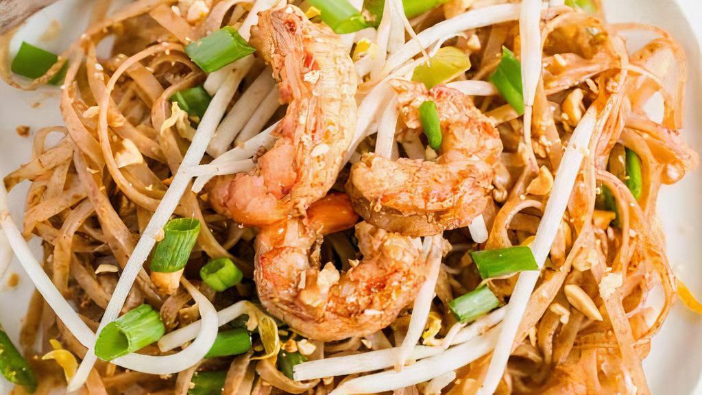 Pad Thai · Spicy.  Flat,  thin rice noodles stir fried with bean sprouts,  egg, fried tofu,  and scallions in sweet Thai  tamarind sauce with your choice of topping.