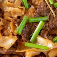 Drunken Noodle · Spicy.  flat,  wide rice noodles tossed with carrots,  onions, bean sprouts,  scallions in T...