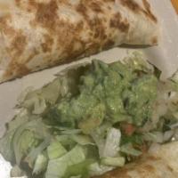 Quesadilla Plate · Shredded chicken, shredded beef, or ground beef quesadilla. Served with 2 sides.