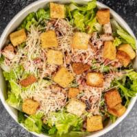 Bacon Chicken Caesar · Grilled chicken , bacon, romaine, parmesan cheese, croutons, caesar
dressing.