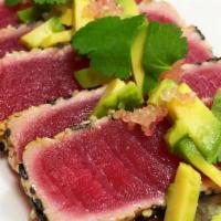 Tuna Tataki · Lightly torched  tuna on bed of spring mix served with ponzu sauce