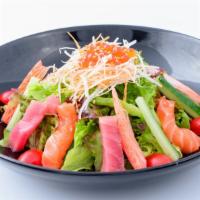 Summer Salad · Based with seaweed salad, springmix, and cucumber. Top with variety sashimi and ponzu sauce.