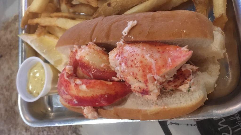 Lobster Roll · Just like many other things from the Northeast, it moved South and acquired Southern flair – a lobster roll served on a toasted split bun with a side of sauce.