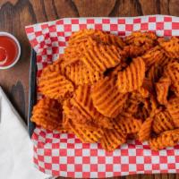 Sweet Potato Waffle Fries · Waffle-cut potatoes fried until crispy and delicious. Fries may be lightly salted or seasone...