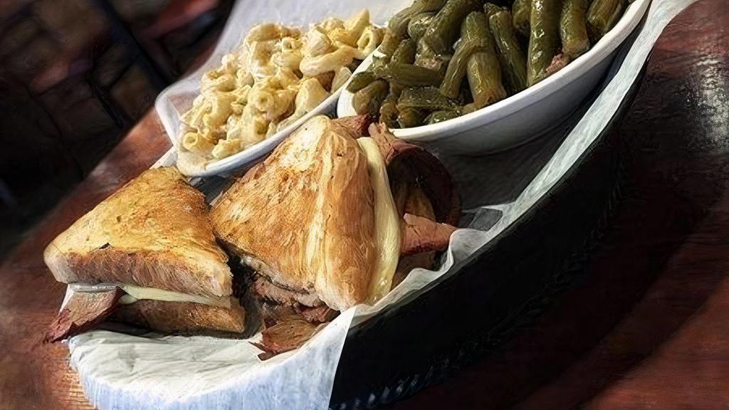 Brisket Grilled Cheese W/ 2 Sides · Lean brisket, covered in our dry rub, smoked over locally sourced Hickory and served on Texas Toast with your choice of white cheddar or Havarti cheese. Comes with two of our house made sides.