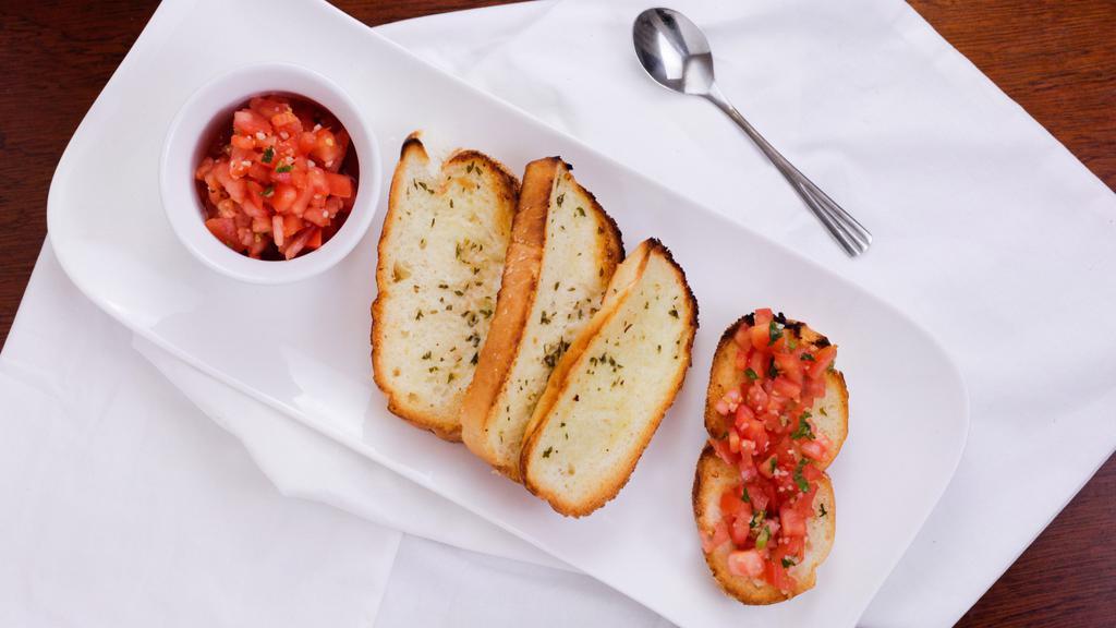 Fresh Tomato Bruschetta · Marinated plum tomato with red onion, fresh basil, and garlic served over our homemade crispy slices of bread.