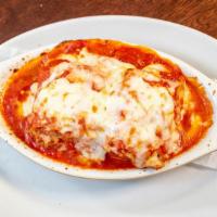 Eggplant Parmigiana · Freshly breaded and fried to golden brown topped with our tomato sauce and mozzarella and ba...