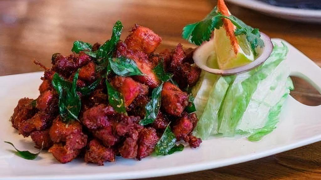 Chicken 65 · Boneless cubes of chicken marinated with a blend of Indian spices and deep friend.