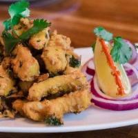 Fish Veruval · Finger shaped fish fillets marinated in freshly made Indian spices and deep-fried until cris...