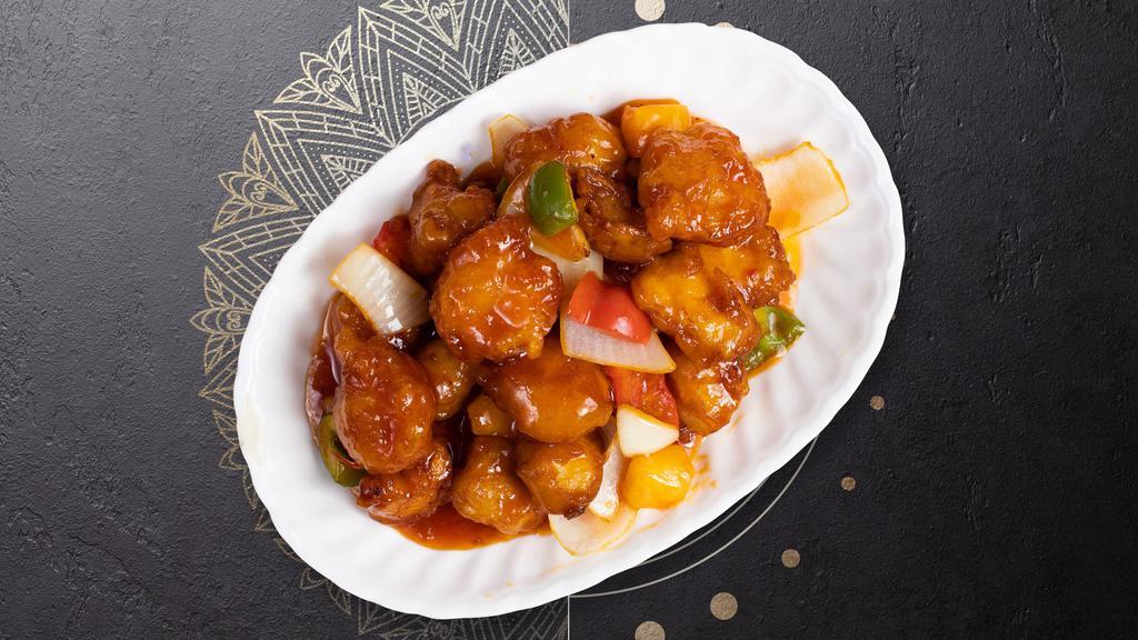 Sweet & Sour Chicken · Deep-fried breaded chicken with a side of sweet and sour sauce, mixed with bell pepper, broccoli, and carrot.