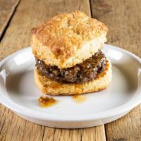 Monticello · Cartwright Family Farms Pork Sausage, Pepper Jelly on one of Reese's Biscuits.