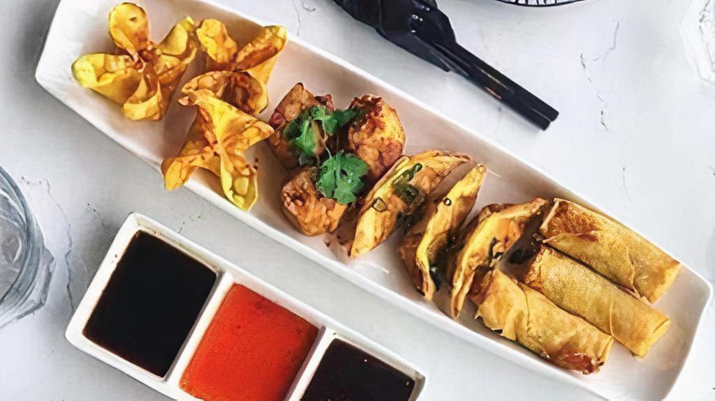 Sampler Platter (Fried)- · Three spring rolls, three fried dumplings, three crab Rangoons and three gyozas: served with our house sauce