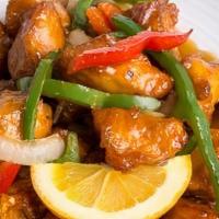 Orange Chicken- · Deep-fried chicken tossed with bell peppers, garlic, and onions; topped with orange sauce an...