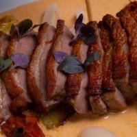 Seared Duck, Red Curry Sauce- · Seared duck with lychee, pineapples, tomatoes, sweet peppers, in red curry sauce, and served...
