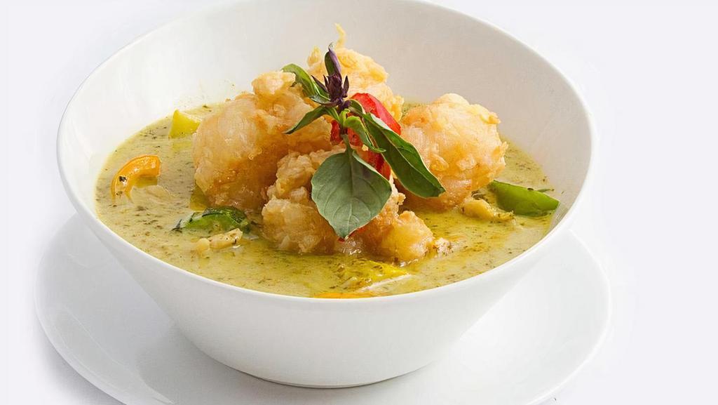 Green Curry- · Green curry blended with creamy coconut milk, carrots, eggplant, bell peppers, and fresh basil leaves