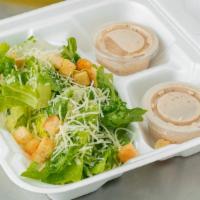 Caesar Salad  · Romaine lettuce , parmesan cheese and crotons with side of Caesar dressing.