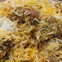 Classic Chicken Biryani · Long grained rice flavored with fragrant spices flavored along with saffron and layered with...