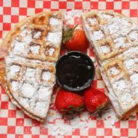 Waffle Monte · Waffle sandwich with hot ham and turkey, provolone and American cheese, topped with powdered...