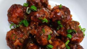 ￼Chili Manchurian (Dry) · Hot. Cubes of chicken tossed with tangy sauce.