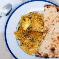 ￼Chicken Briyani · Halal. Hot. Chicken pieces in creamy, spicy blend of ginger garlic, onions and fresh herbs c...