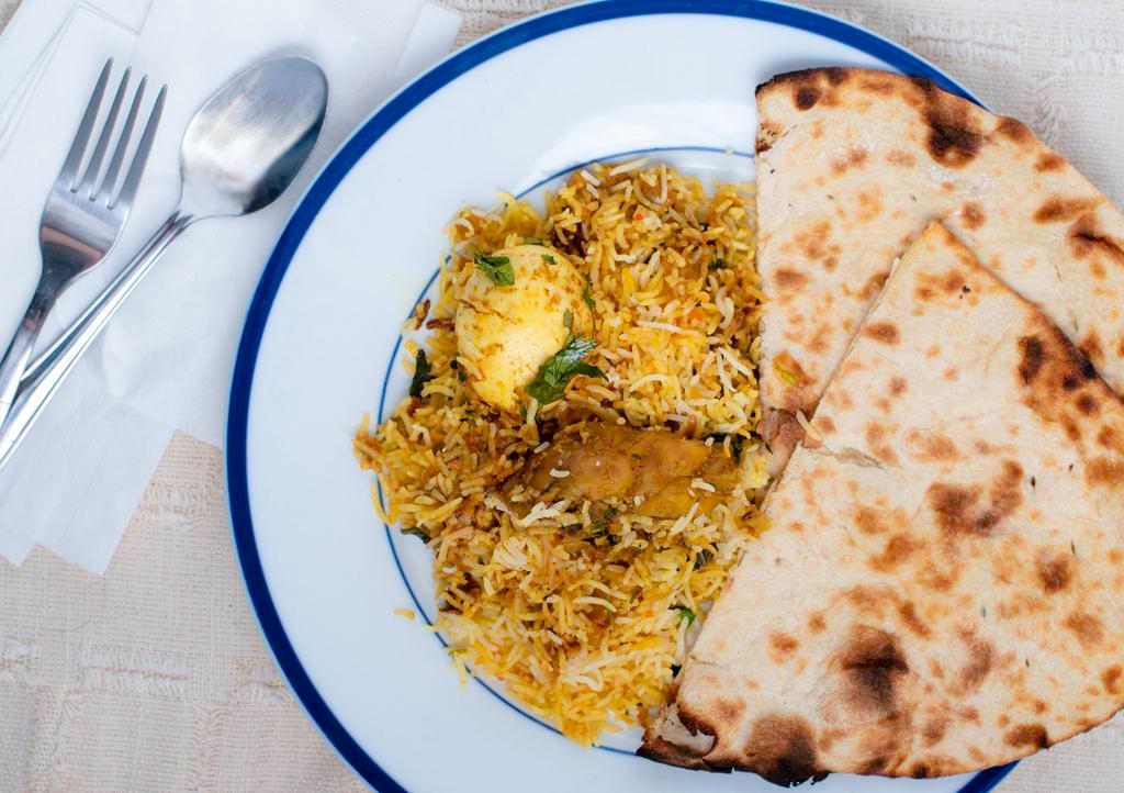 ￼Chicken Briyani · Halal. Hot. Chicken pieces in creamy, spicy blend of ginger garlic, onions and fresh herbs combined with saffron flavored basmati rice.