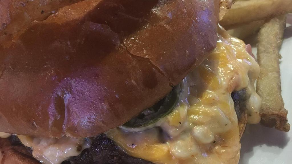 Bang Pow Burger · Prospect's signature burger. 1/2 lb patty, topped with pimento cheese, jalapeno and sriracha.