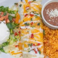 Burrito Special · Special one big flour tortilla filled with grilled chicken, chorizo, rice, and beans. Topped...