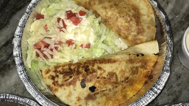 Quesadilla De Chorizo · Two quesadillas filled with cheese and mexican sausage. Served with a creme salad.