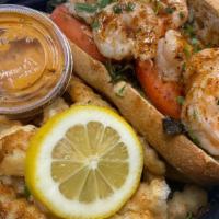 Shrimp Po'Boy · Served on french bread with lettuce & tomatoes topped with a homemade remoulade sauce and ca...
