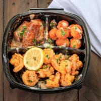 Half Shrimp Combo · Jumbo shrimp (fried or cajun) & 2 sides topped with Seafood lady sauce, and garnished with f...