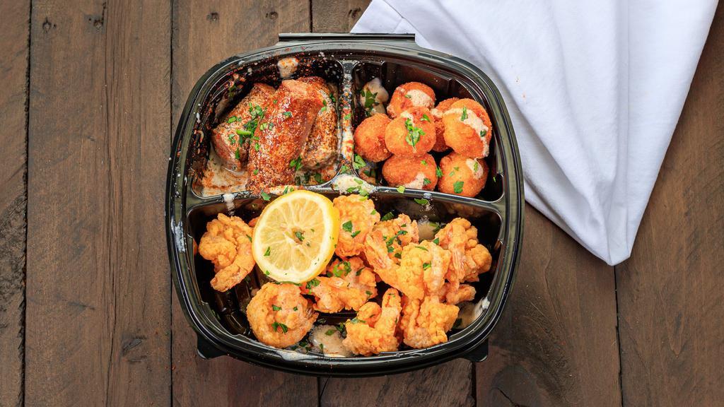 Half Shrimp Combo · Jumbo shrimp (fried or cajun) & 2 sides topped with Seafood lady sauce, and garnished with fresh parsley and lemon slices.