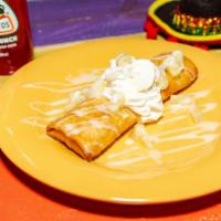 Pina Colada Fried Cheesecake · Rich, smooth cheesecake rolled in a flaky pastry tortilla, deep fried and topped with chunke...