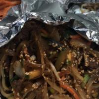 Jobchae · Stir fried clear noodles with green onions, onions, mushroom, carrots and zucchini.