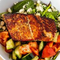 Grilled Salmon Salad · Fresh char grilled salmon filet served over crisp mixed greens, marinated cucumber and tomat...