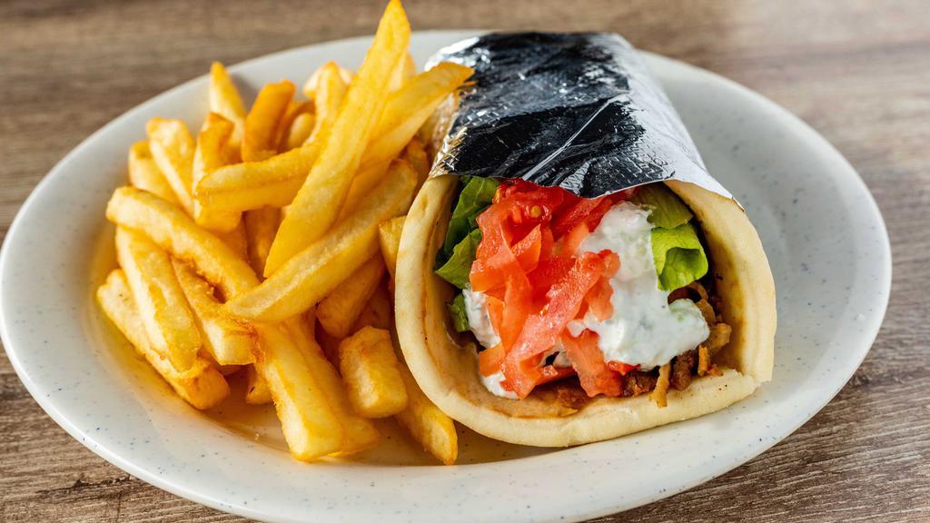 Gyro · Gyro slices served on pita bread with lettuces, tomatoes and tzatziki sauce.