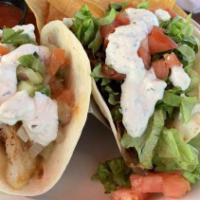 Gyro Tacos · Lettuce, tomato, diced onions and tzatziki sauce.