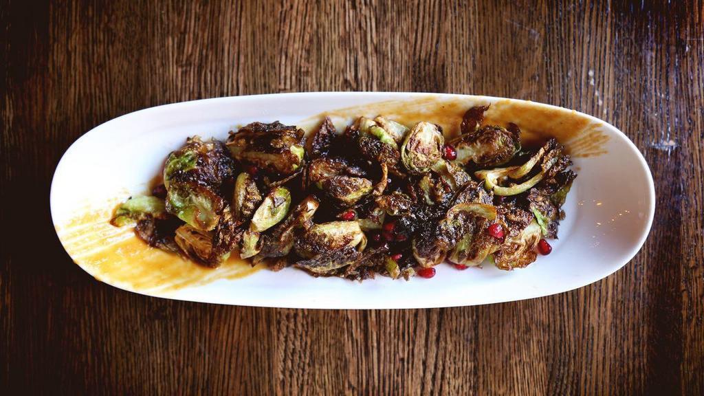 Charred Brussel Sprouts · white miso, pomegranate