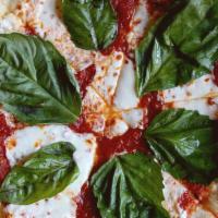 Classic Margherita · Tomato sauce, fresh Mozzarella, extra virgin olive oil, basil.