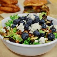 Blue Salad · Spring mix, crumbled blue cheese, honey roasted pecans, blueberries, apricot vinaigrette
