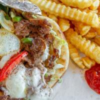 Philly Steak Wrap · Grilled with onions peppers lettuce tomato cheese and mayonnaise. pita wraps come with frenc...