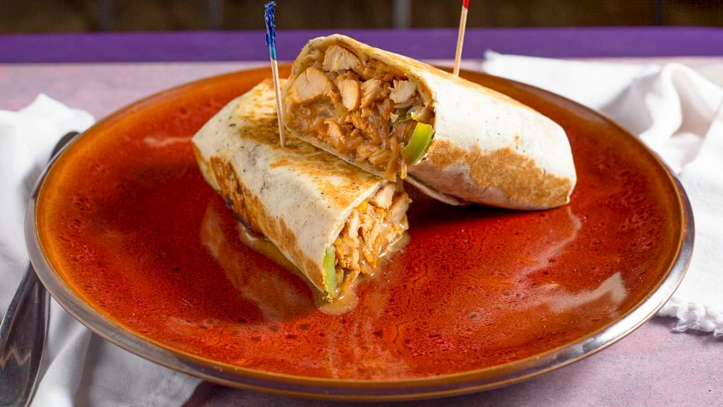 Spicy Chicken Wrap (French) · Grilled chicken, cheddar & Monterey jack, grilled onions, bell pepper, jalapeño, tomatoes, garlic herb tortilla and ranch.