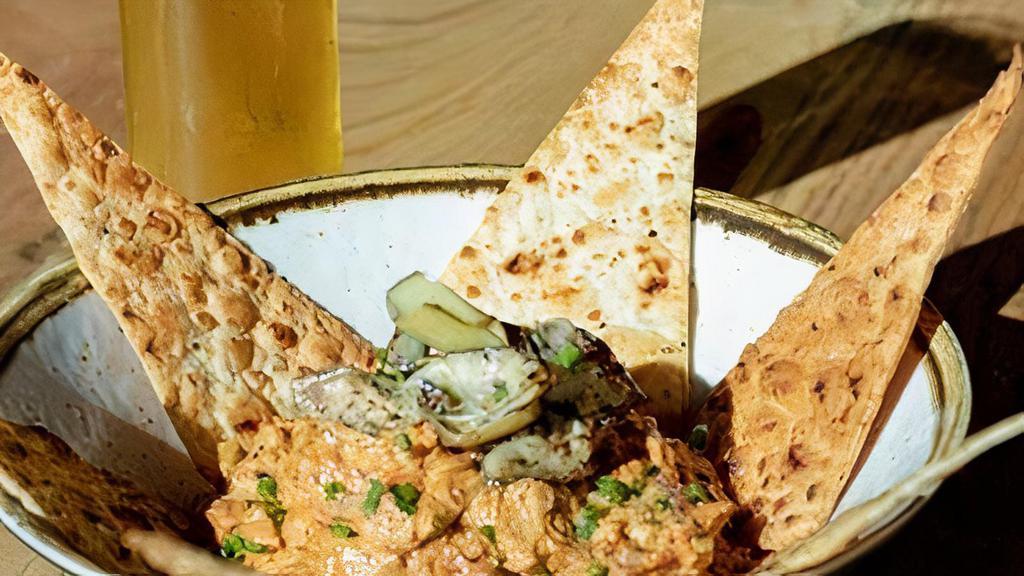 Wood-Grilled Artichoke And Sun Dried Tomato Dip · A creamy spread baked with grilled artichokes and sundried tomatoes served with crisp ﬂatbread