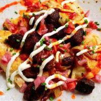 Pimento Cheese And Potato Pierogis · With local pork carnitas, pickled red onion and sour cream