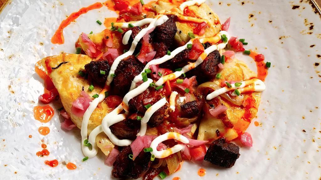 Pimento Cheese And Potato Pierogis · With local pork carnitas, pickled red onion and sour cream