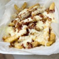 Cheese Fried Steak Fries · Topped with mozzarella cheese, white Cheddar cheese and crisp bacon. Served with our ranch d...
