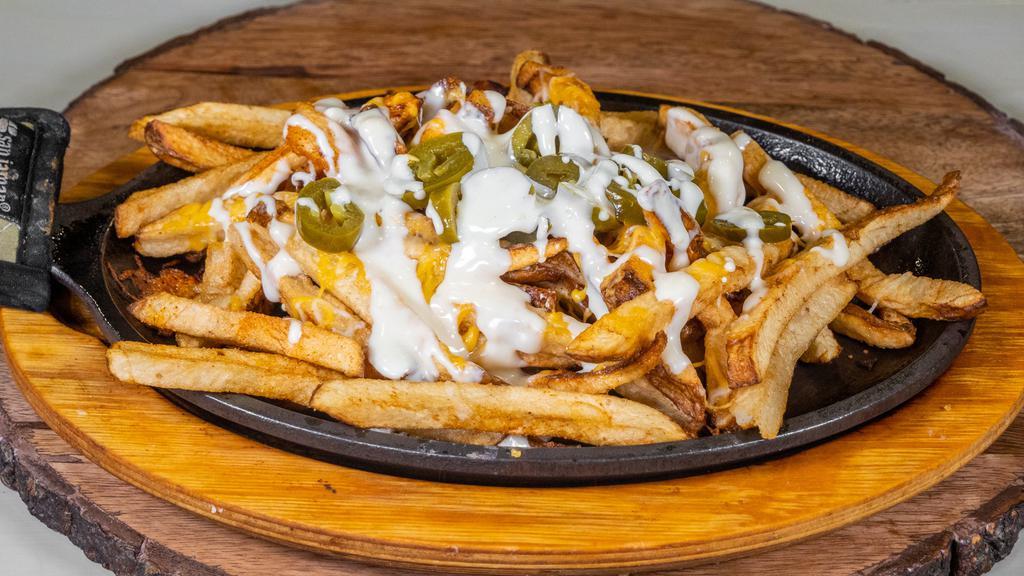 Cheese Fries · Choice of grilled chicken, bacon,  or chorizo with cheese and jalapeños.