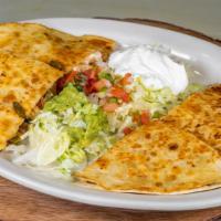 Quesadilla Deluxe · Choice of Grilled Chicken or Steak Cooked With Onions. Bell peppers and tomatoes topped of W...