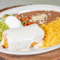 Chimichanga Dinner · Shredded chicken or ground beef topped with cheese sauce, lettuce, sour cream, guacamole, pi...
