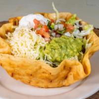 Taco Salad · Ground beef or chicken, lettuce guacamole, sour cream, tomatoes and cheese.